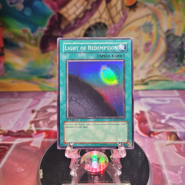 A 1st edition Super Rare "Light of Redemption" card from the Yugioh Set: Light of Destruction.