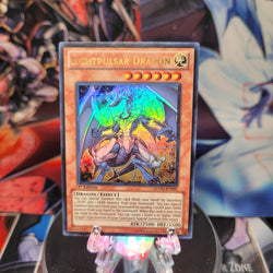 An Ultra Rare "Lightpulsar Dragon" card from the Yugioh Structure Deck: Dragons Collide.