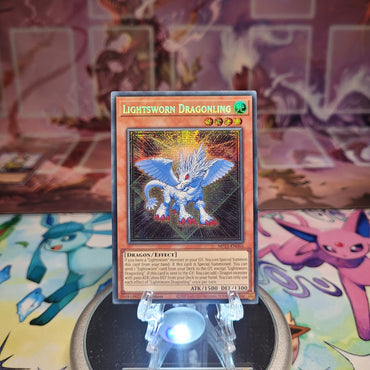 A Prismatic Secret Rare "Lightsworn Dragonling" card from the Yugioh 2025 Mega-Tin Mega Pack set (MP25).