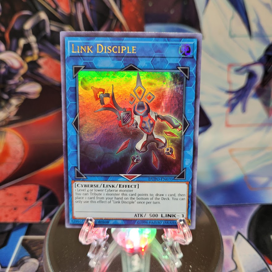 An Ultra Rare "Link Disciple" card from the Yugioh Set: Duel Power.