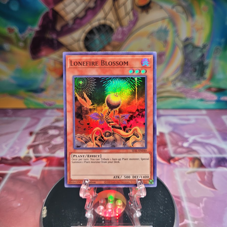 A Super Rare "Lonefire Blossom" card from the Yugioh Set: Secret Slayers.