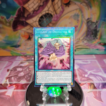 A Prismatic Collector's Rare "Lullaby of Obedience" card from the Yugioh Set: Quarter Century Stampede (RA04).