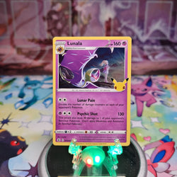 A Holo Rare "Lunala" (015/025) card from the Pokemon Set: Sword & Shield: Celebrations.