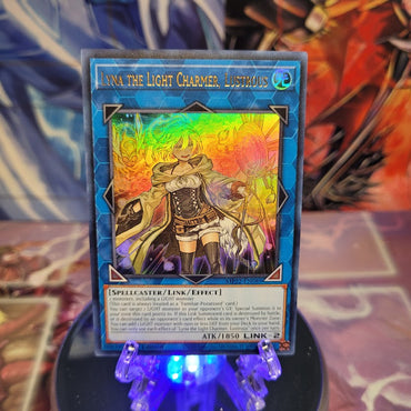 An Ultra Rare "Lyna the Light Charmer, Lustrous" card from the Yugioh 2022 Tin of the Pharaoh's Gods Set (MP22).