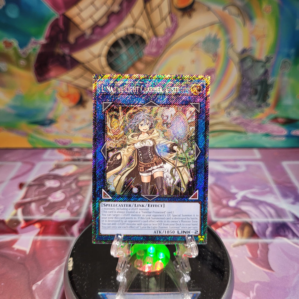 A Platinum Secret Rare "Lyna the Light Charmer, Lustrous" card from the Yugioh Set: Quarter Century Stampede (RA04).