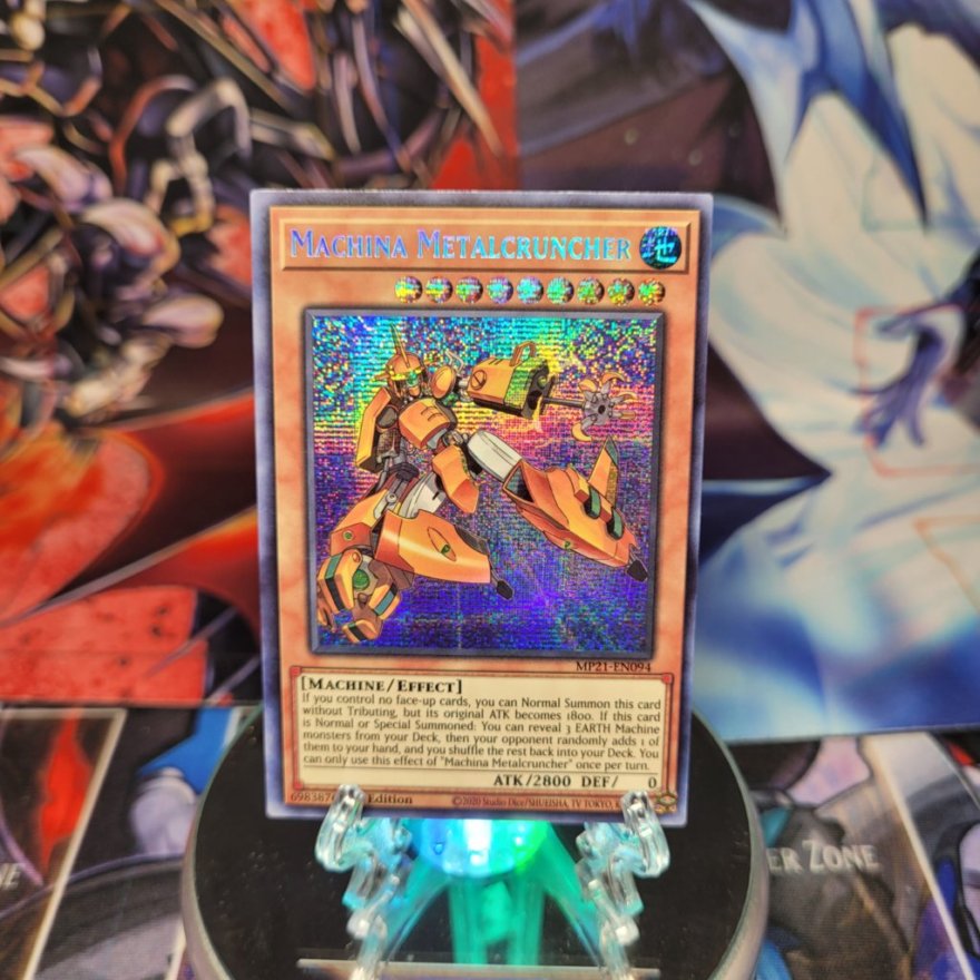 A Prismatic Secret Rare "Machina Metalcruncher" card from the Yugioh 2021 Tin of Ancient Battles.