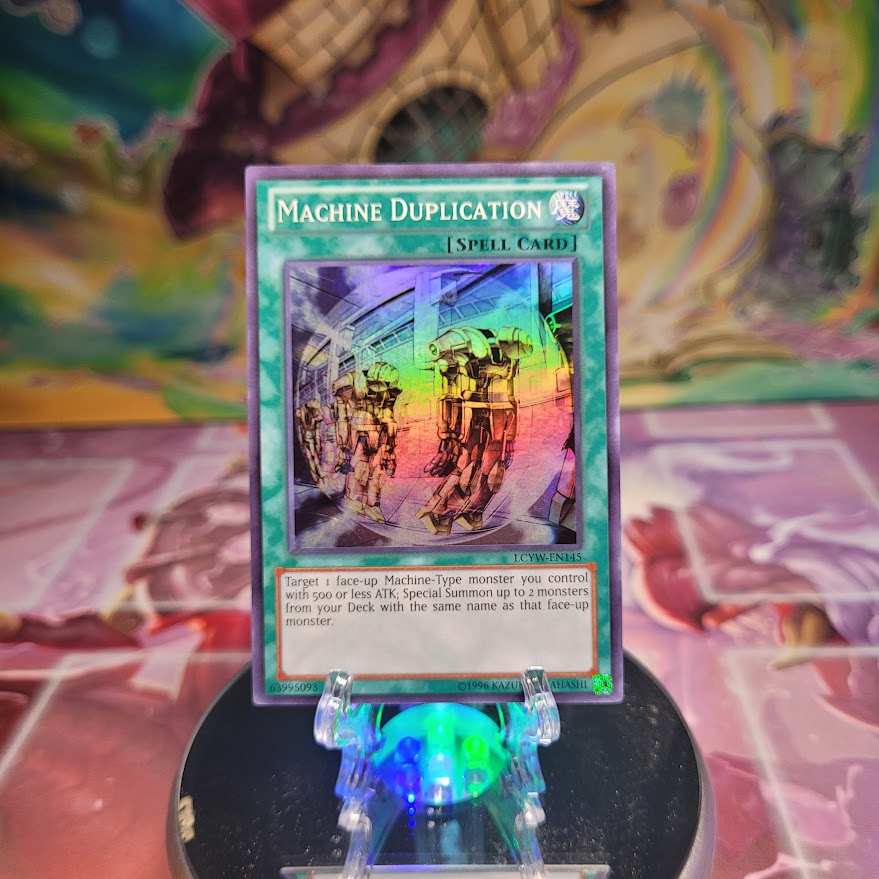 An Unlimited Edition Super Rare "Machine Duplication" card from the Yugioh Set: Legendary Collection 3: Yugi's World.