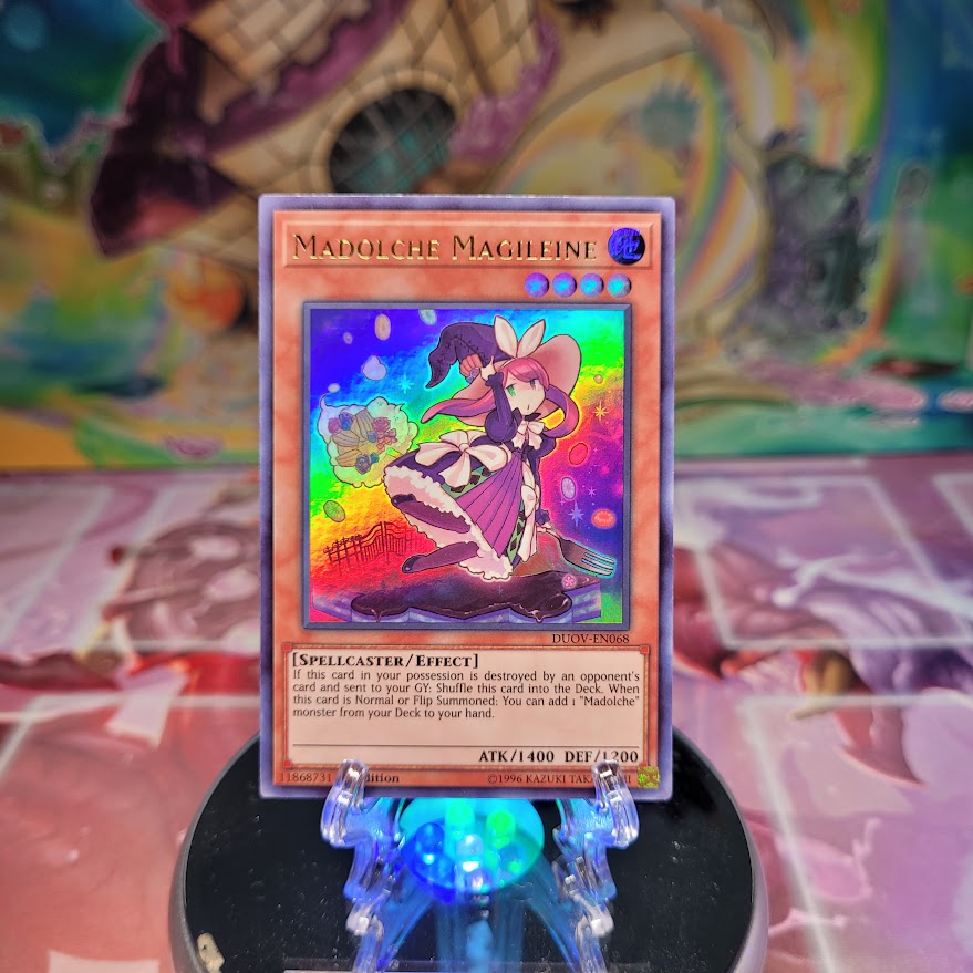 An Ultra Rare "Madolche Magileine" card from the Yugioh Set: Duel Overload (DUOV).