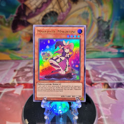 An Ultra Rare "Madolche Magileine" card from the Yugioh Set: Duel Overload (DUOV).