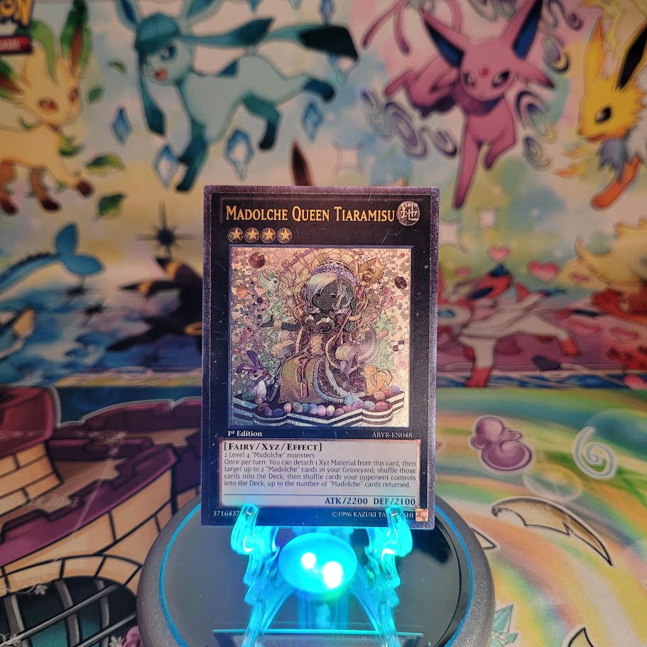 An Ultimate Rare "Madolche Queen Tiaramisu" card from the Yugioh Set: Abyss Rising (ABYR).