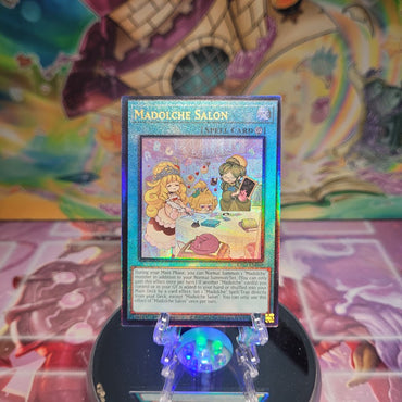 A Prismatic Ultimate Rare "Madolche Salon" card from the Yugioh Set: Quarter Century Bonanza (RA03).