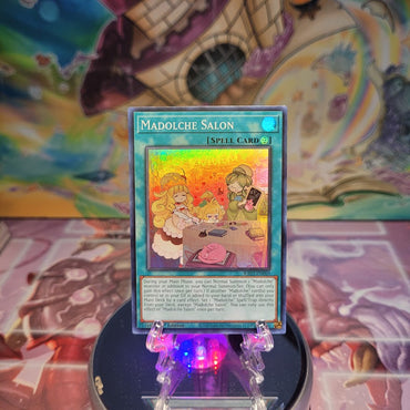 A Super Rare "Madolche Salon" card from the Yugioh Set: Quarter Century Bonanza (RA03).