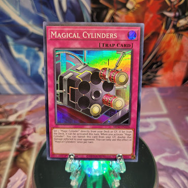 A Super Rare "Magical Cylinders" card from the Yugioh 2022 Tin of the Pharaoh's Gods Set.