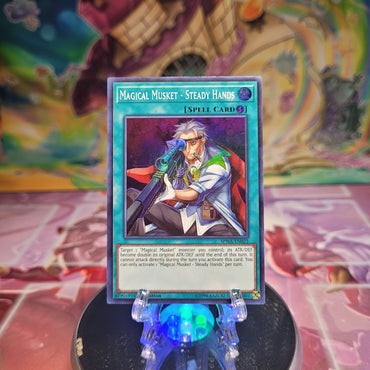 A 1st Edition Super Rare "Magical Musket - Steady Hands" card from the Yugioh Set: Spirit Warriors.