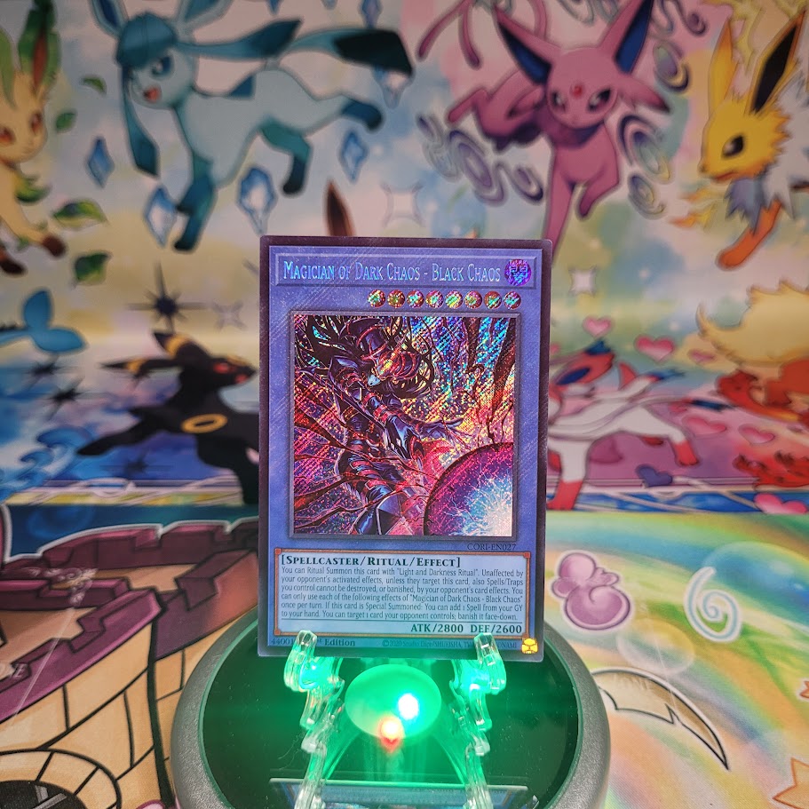 A Secret Rare “Magician of Dark Chaos - Black Chaos” card from the Yugioh Set: Chaos Origins (CORI).