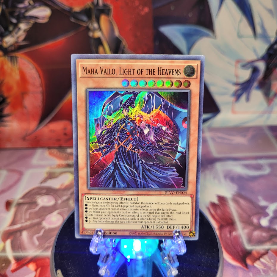 A Super Rare "Maha Vailo, Light of the Heavens" card from the Yugioh Set: Blazing Vortex.