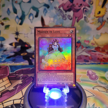 A Super Rare "Maiden in Love" card from the Yugioh Set: Maze of Muertos (MZMU).