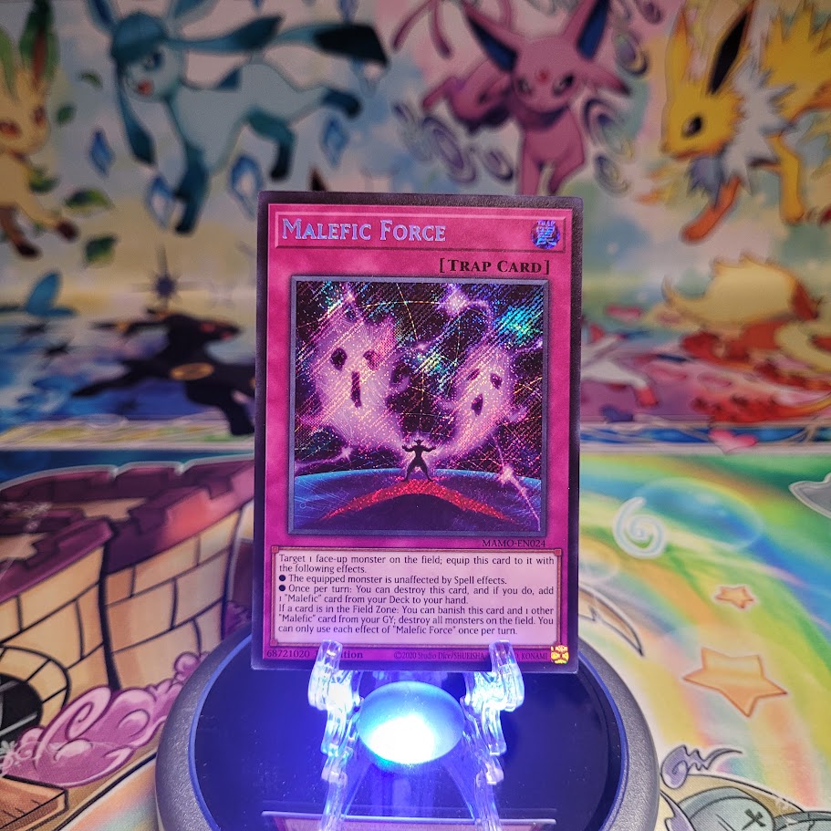 A Secret Rare "Malefic Force" card from the Yugioh Set: Magnificent Monsters (MAMO).