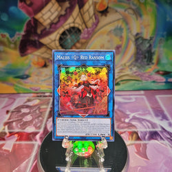 A Super Rare "Maliss Q Red Ransom" card from the Yugioh Set: Crossover Breakers.
