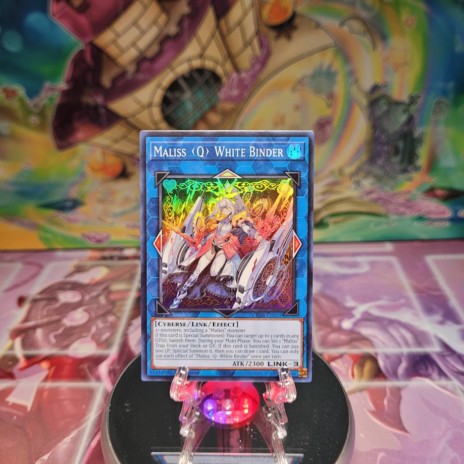 A Super Rare "Maliss Q White Binder" card from the Yugioh Set: Crossover Breakers.
