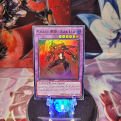 A Super Rare "Masked Hero Dark Law" card from the Yugioh Set: Rarity Collection 1 (RA01).