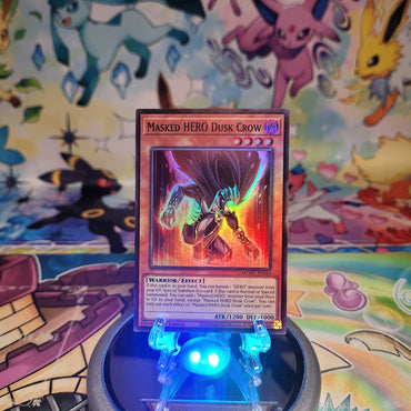 A Super Rare "Masked Hero Dusk Crow" card from the Yugioh Set: Maze of Muertos (MZMU).