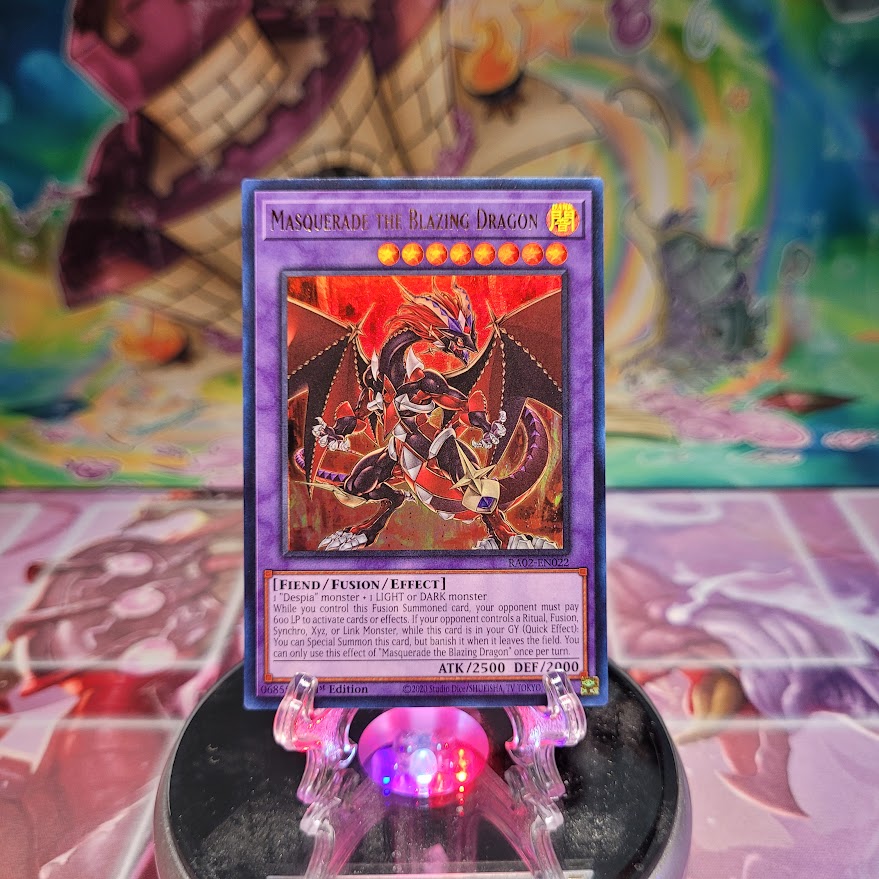 An Ultra Rare "Masquerade the Blazing Dragon" card from the Yugioh Set: Rarity Collection 2 (RA02).