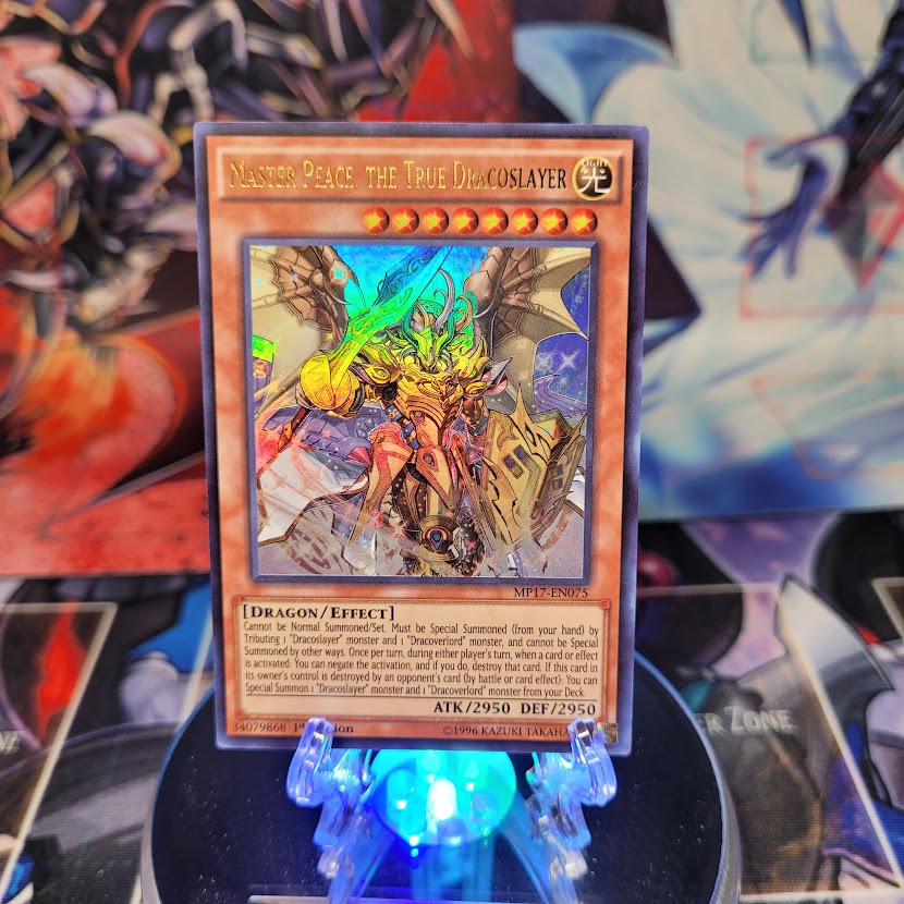 An Ultra Rare "Master Peace the True Dracoslayer" card from the Yugioh 2017 Mega-Tins Mega Pack.