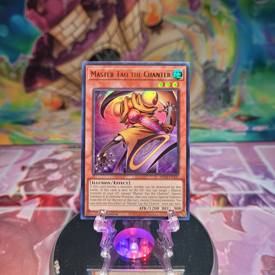 An Ultra Rare "Master Tao the Chanter" card from the Yugioh Set: 25th Anniversary Tin: Dueling Mirrors (MP24).