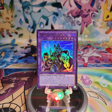 An Ultra Rare "Master of Chaos" card from the Yugioh Set: Magnificent Monsters (MAMO).
