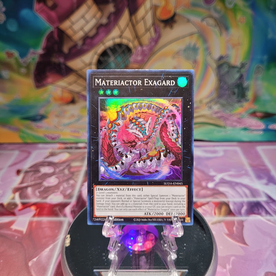 A Super Rare "Materiactor Exagard" card from the Yugioh Set: Supreme Darkness (SUDA).