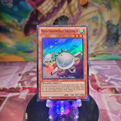 A Super Rare "Mecha Phantom Beast Turtletracer" card from the Yugioh Set: Lord of the Tachyon Galaxy.