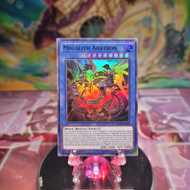 A Super Rare "Megalith Aratron" card from the Yugioh Set: Ignition Assault.