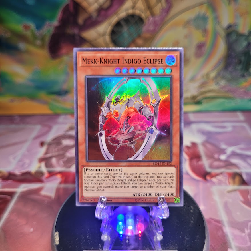 A Super Rare "Mekk-Knight Indigo Eclipse" card from the 2018 Yugioh Mega Tins: Mega Pack.