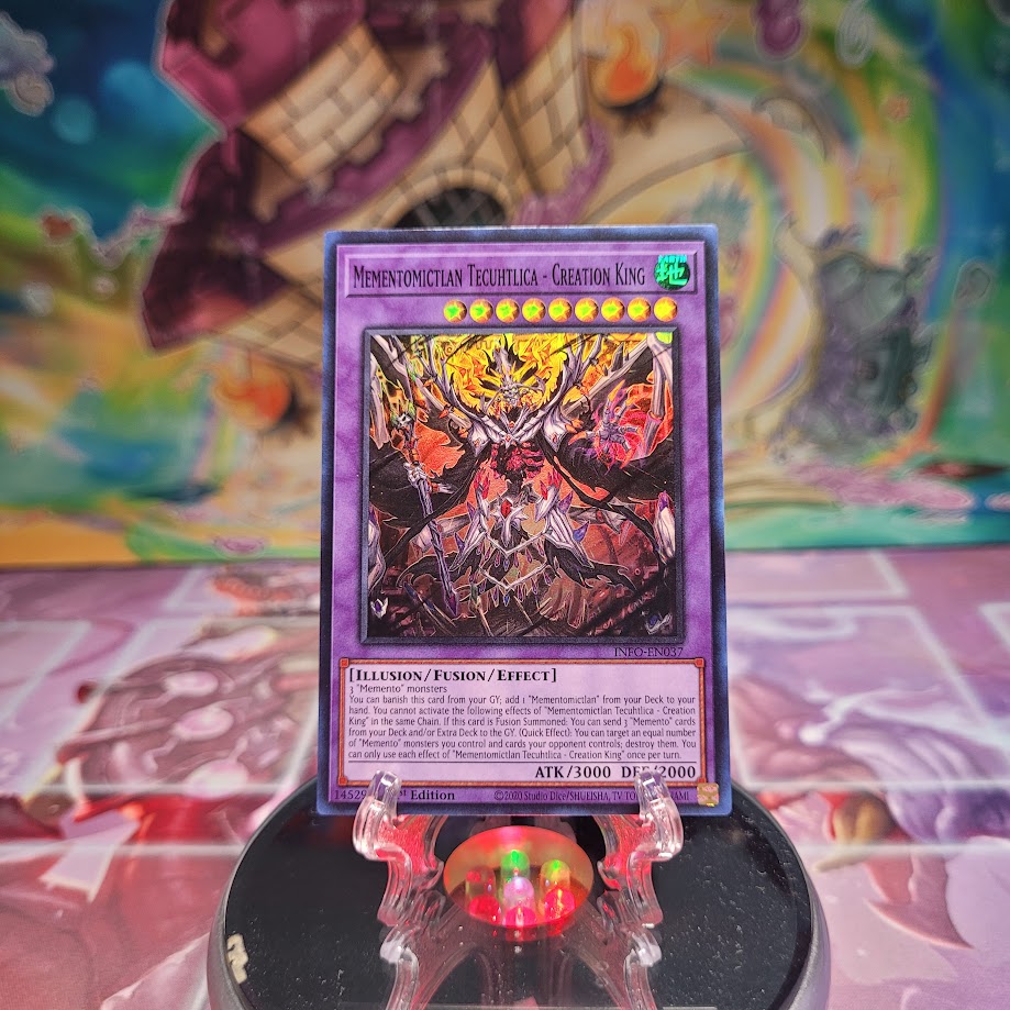 A Super Rare "Mementomictlan Tecuhtlica - Creation King" card from the Yugioh Set: The Infinite Forbidden.