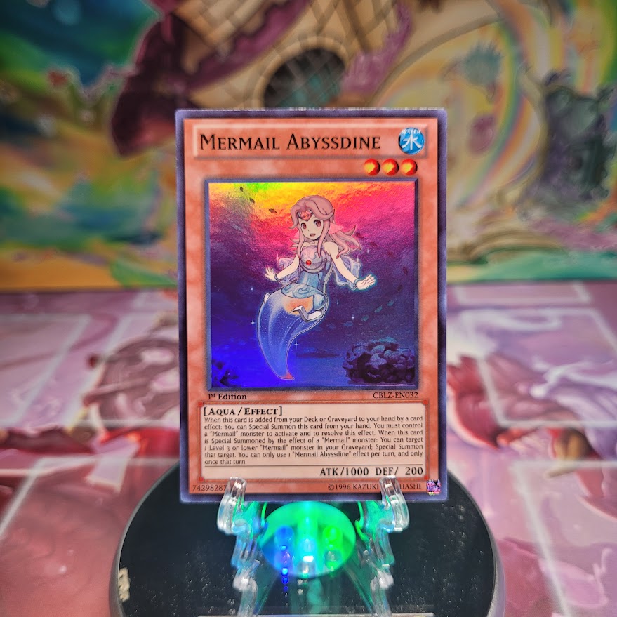 A Super Rare "Mermail Abyssdine" card from the Yugioh Set: Cosmo Blazer.