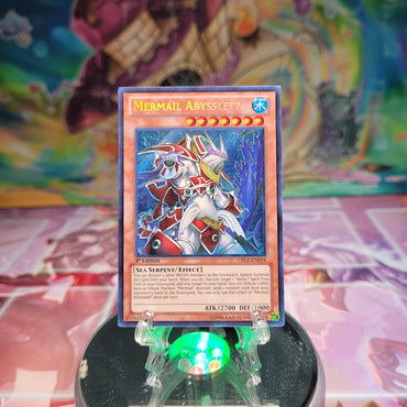 A Secret Rare "Mermail Abyssleed" card from the Yugioh Set: Cosmo Blazar.