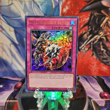 An Ultra Rare "Metal Reflect Slime" card from the Yugioh Set: Magnificent Mavens.