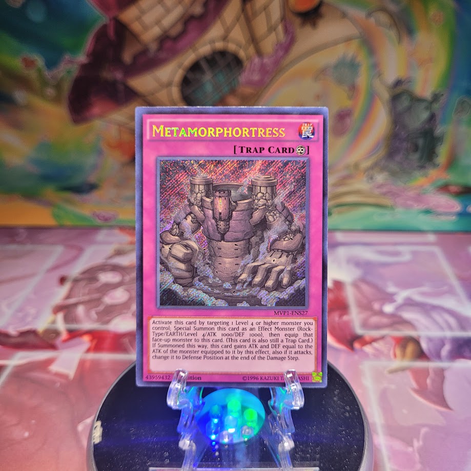 A Secret Rare "Metamorphortress" card from the Yugioh Set: The Dark Side of Dimensions: Secret Edition.