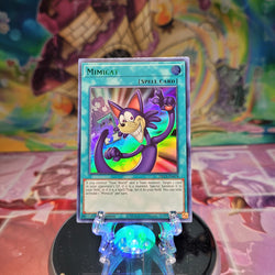 An Ultra Rare Green "Mimicat" card from the Yugioh Set: Dragons of Legend: The Complete Series (DLCS).