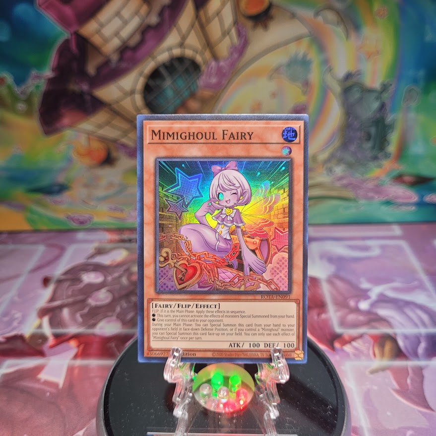 A Super Rare "Mimighoul Fairy" card from the Yugioh Set: Rage of the Abyss (ROTA).