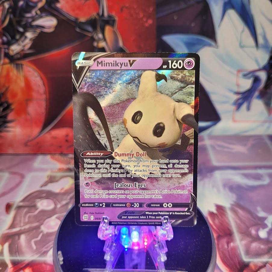 An Ultra Rare "Mimikyu V" (068/172) card from the Pokemon Set: Brilliant Stars.