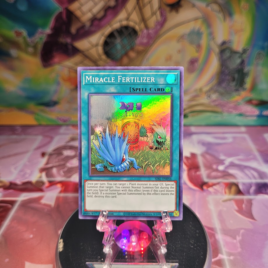 A Super Rare "Miracle Fertilizer" card from the Yugioh Set: Secret Slayers.