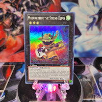 A Super Rare "Muzurhythm the String Djinn" card from the Yugioh Starter Deck: Xyz Symphony.