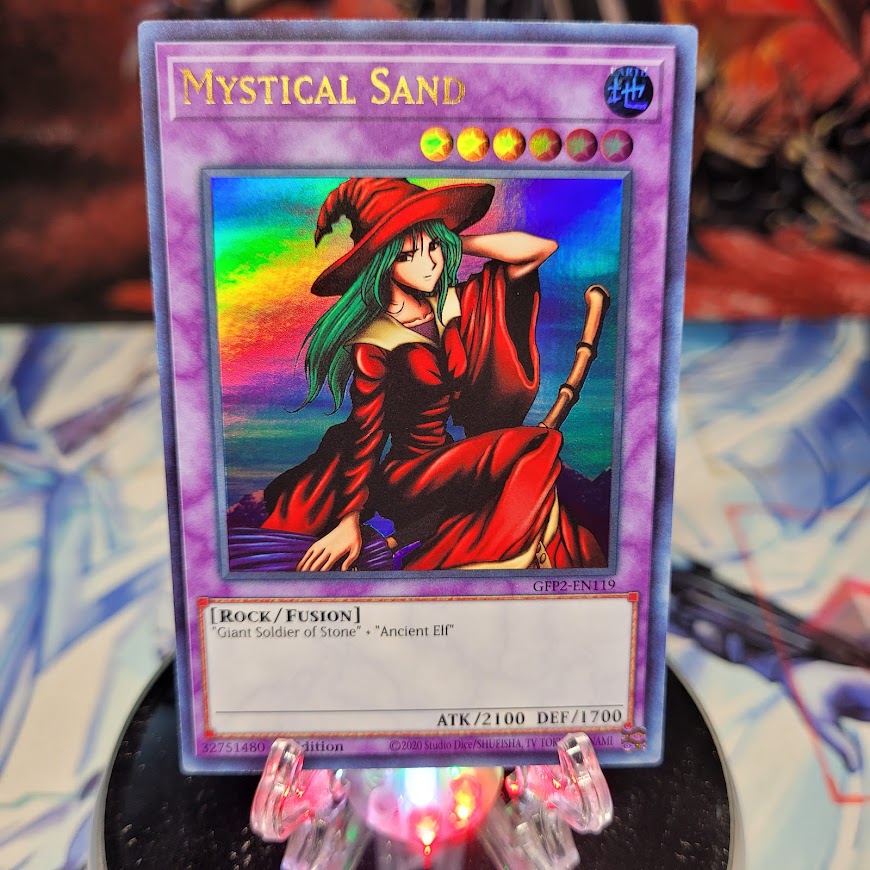  An Ultra Rare "Mystical Sand" card from the Yugioh Set: Ghosts From the Past: The 2nd Haunting (GFP2).