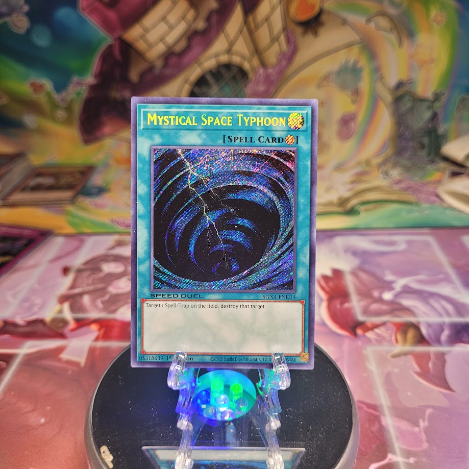  A Secret Rare "Mystical Space Typhoon" card from the Yugioh Set: Speed Duel GX: Midterm Destruction (SGX4).