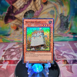 A Duel Terminal Super Rare "Naturia Cliff" card from the Yugioh Set: Duel Terminal 3 (DT03).