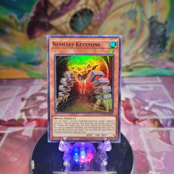 A Super Rare "Nemeses Keystone" card from the Yugioh Set: Rise of the Duelists (ROTD).