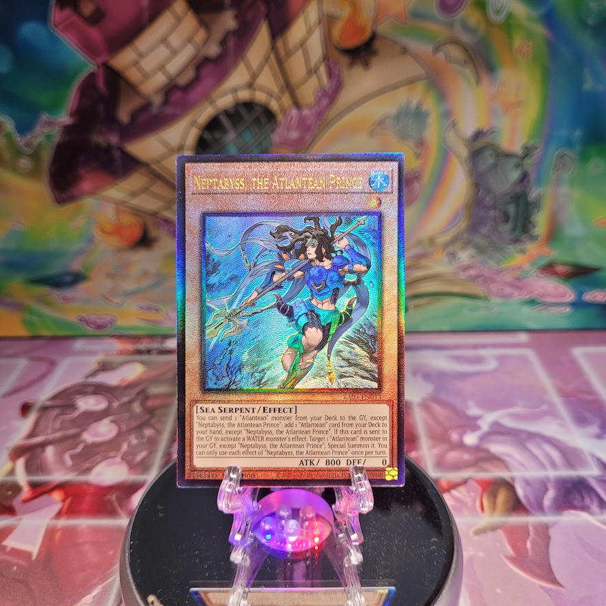 A Prismatic Ultimate Rare "Neptabyss, the Atlantean Prince" card from the Yugioh Set: Quarter Century Bonanza (RA03).