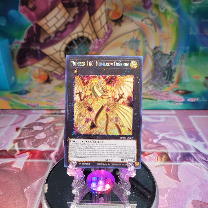 A Platinum Secret Rare "Number 100: Numeron Dragon" card from the Yugioh Set: Rarity Collection 1 (RA01).